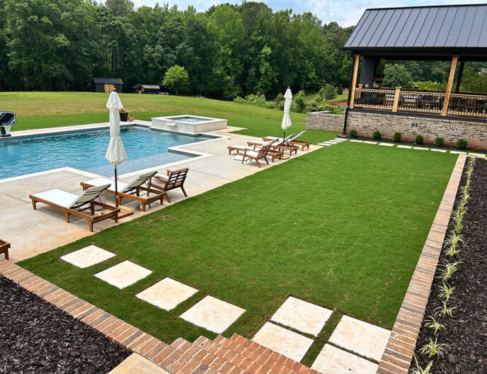 Backyard pool, patio, and green yard