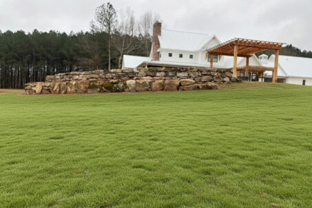 Green lawn with retaining wall